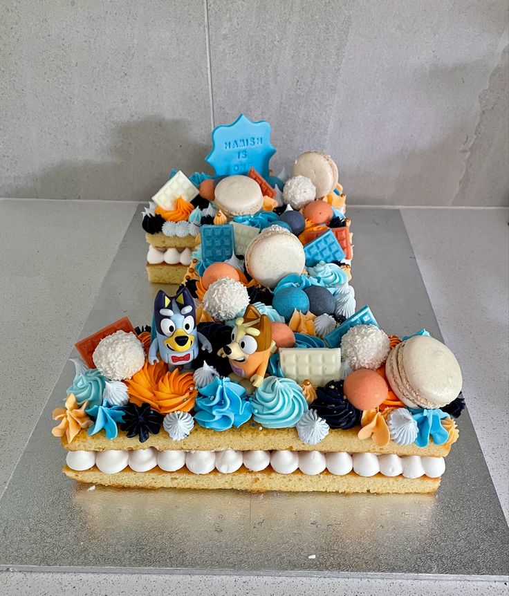 a cake that has been decorated to look like a boat with many items on it