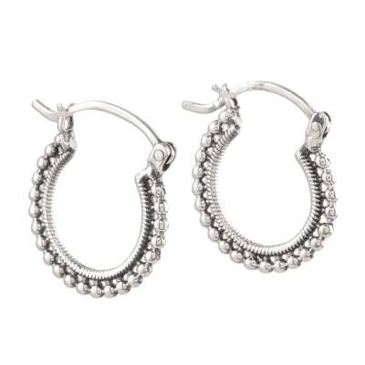 Ropelike hoops of sterling silver are ornamented by brightly polished silver beads in this design from Neetu Barathi in India. The earrings are perfect for everyday wear but still eye-catching enough for a special occasion. Silver Hoop Earrings With Oxidized Finish For Festive Occasion, Festive Silver Hoop Earrings With Oxidized Finish, Silver Hoop Beaded Jewelry, Silver Beaded Hoop Earrings In Sterling Silver, Silver Beaded Hoop Jewelry, Silver Sterling Beaded Hoop Earrings, Silver Beaded Sterling Silver Hoop Earrings, Silver Hoop Earrings With Silver Beads, Silver Earrings With Polished Beads