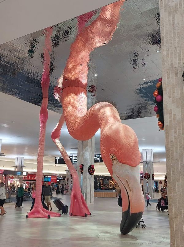 a flamingo sculpture in the middle of a mall