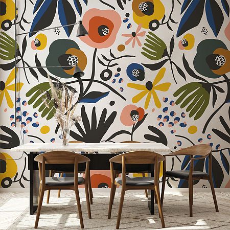 two chairs and a table in front of a colorful wallpapered dining room area