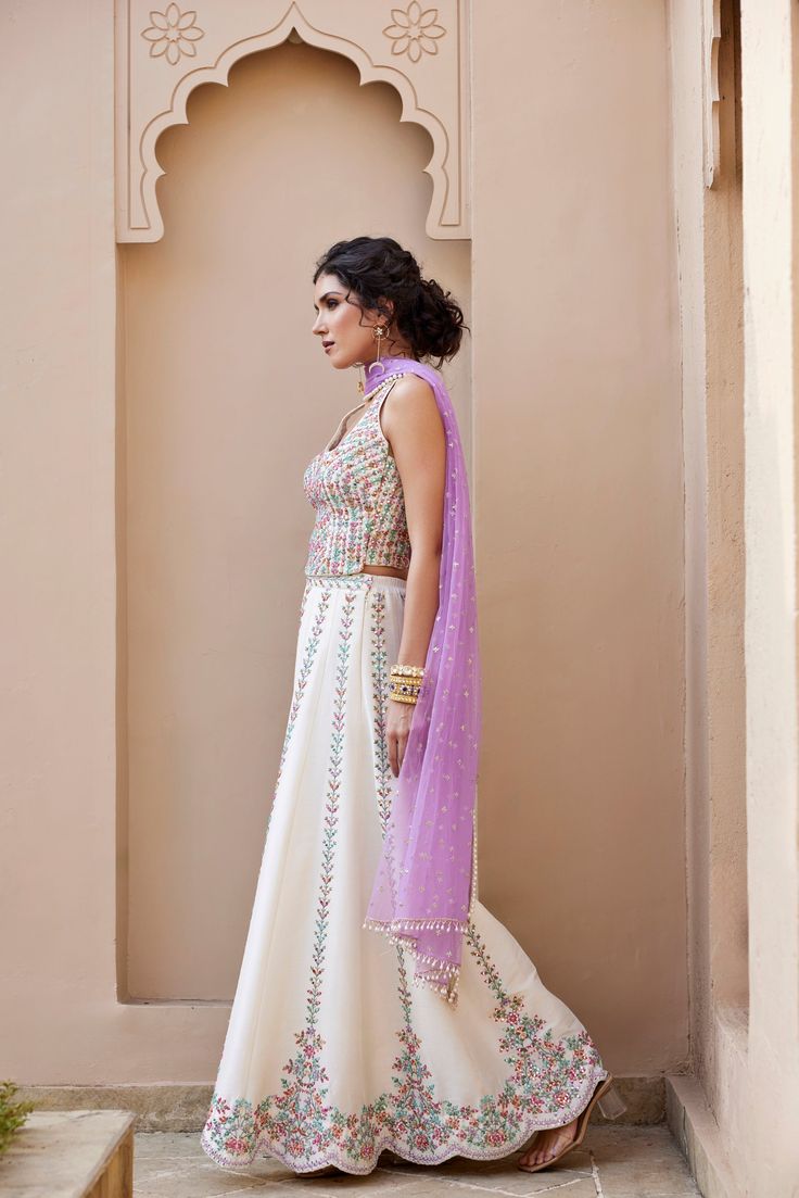 Mirror and Colorful resham Embroidered Ivory dupion silk top and flared pant Paired with contrast lavender Tulle dupatta with pearl embroidery detailing .From Chamee and Palak's The Romantics collection.DELIVERY TIMEPlease allow 8-12 weeks for your outfit to arrive.FABRIC DETAILSDupion SilkProfessional cleaning only. The Romantics, Pearl Embroidery, Embroidery Detailing, Dupion Silk, Change Image, 12 Weeks, Silk Top, Body Measurements, Skirt Length