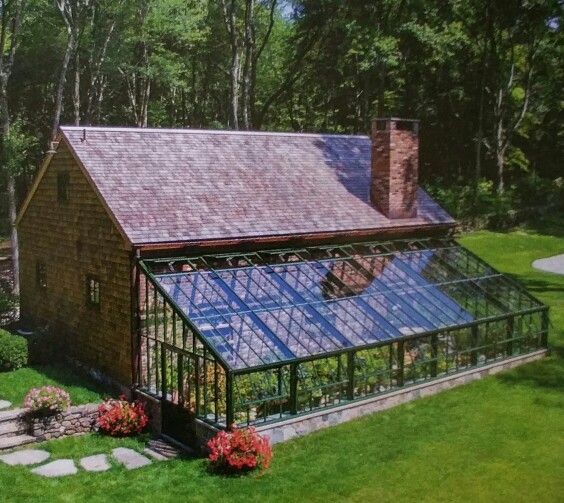 an aerial view of a house with a greenhouse