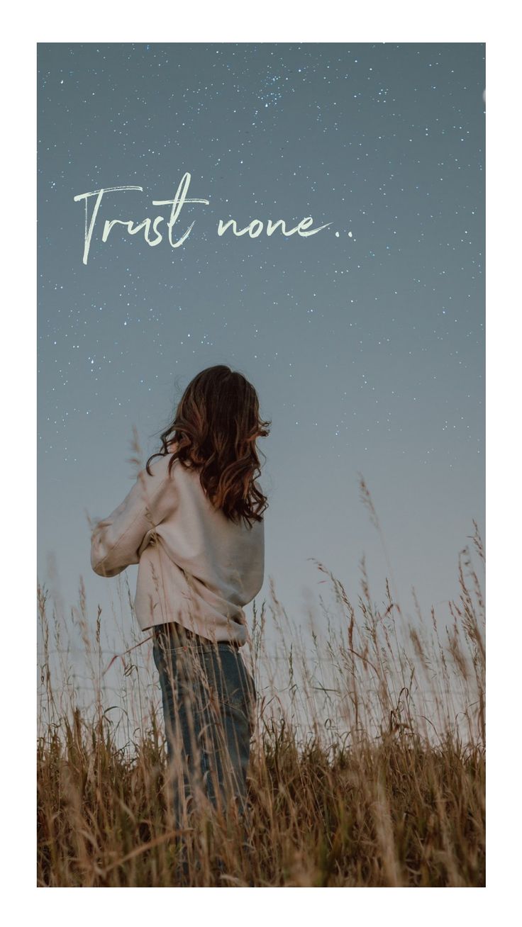 a woman standing in tall grass with the words trust none above her head and stars overhead