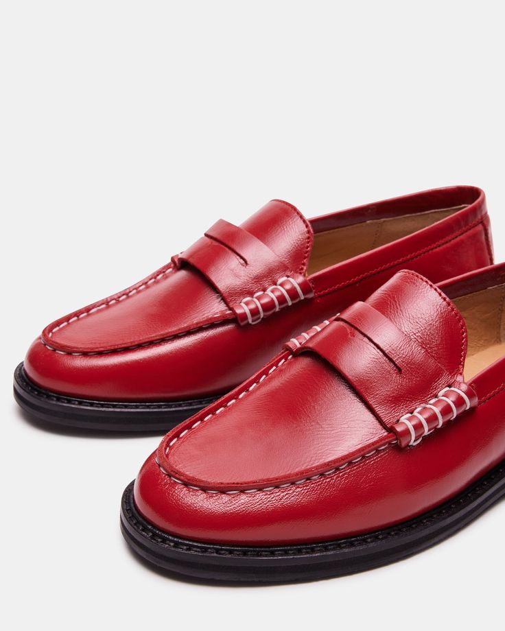 Upgrade your shoe game with the MADISON loafer. Crafted with luxurious leather, this stylish shoe adds a touch of sophistication to any outfit. Step into comfort and class with every step. 1 inch heel height Leather upper material Leather lining Leather sock Synthetic sole Imported Classic Loafers With Red Sole For Work, Classic Loafers With Red Sole For Office, Classic Tassel Loafers With Red Sole, Classic Slip-on Loafers With Red Sole, Red Business Loafers, Red Business Loafers For Fall, Classic Red Almond Toe Loafers, Red Almond Toe Loafers For Business, Business Red Almond Toe Loafers