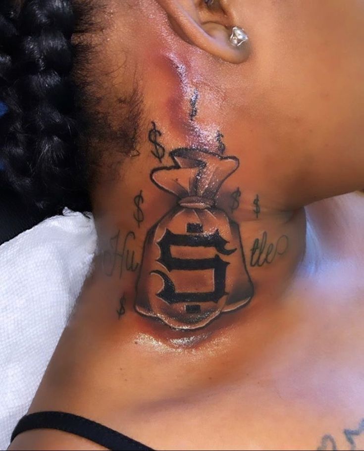 a woman with a tattoo on her neck