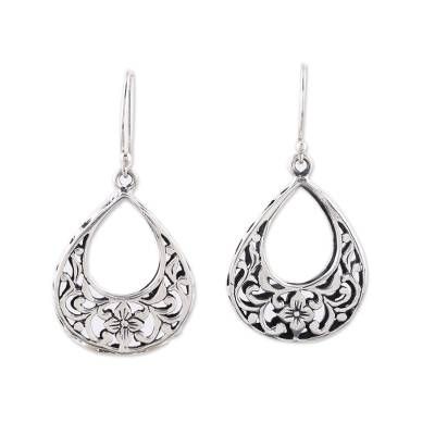 Featuring floral openwork of majestic beauty these dangle earrings are designed by Indian artisan Bhavya Jain. She crafts each earring from sterling silver in a drop shape accentuated by a combination of finishes. Sterling Silver Teardrop Earrings With Intricate Design, Intricate Metal Drop Danglers, Silver Intricate Design Drop Earrings, Sterling Silver Danglers With Intricate Design, Ornate Silver Danglers With Intricate Design, Sterling Silver Intricate Teardrop Earrings, Bohemian Sterling Silver Teardrop Earrings With Intricate Design, Ornate Sterling Silver Teardrop Earrings, Teardrop Filigree Chandelier Earrings