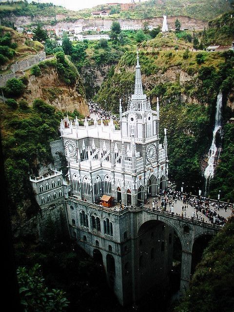 an aerial view of a castle in the mountains