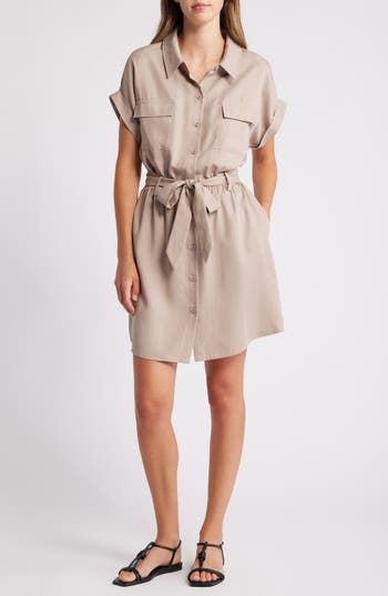 This picture-of-polish shirtdress is designed with chest-flap pockets and a defining tie belt. 36 1/2" length (size Medium) Front button closure Spread collar Short sleeves Chest flap pockets Tie belt Unlined 100% lyocell Machine wash, line dry Imported Spring Collared Shirt Dress With Roll-up Sleeves, Casual Shirt Dress With Spread Collar For Work, Button-up Shirt Dress With Pockets For Daywear, Collared Shirt Dress With Placket For Work, Knee-length Shirt Dress With Roll-up Sleeves For Work, Spring Button-up Shirt Dress With Pockets, Short Sleeve Shirt Dress With Pockets For Fall, Chic Spring Shirt Dress With Tie Fastening, Chic Workwear Shirt Dress With Roll-up Sleeves