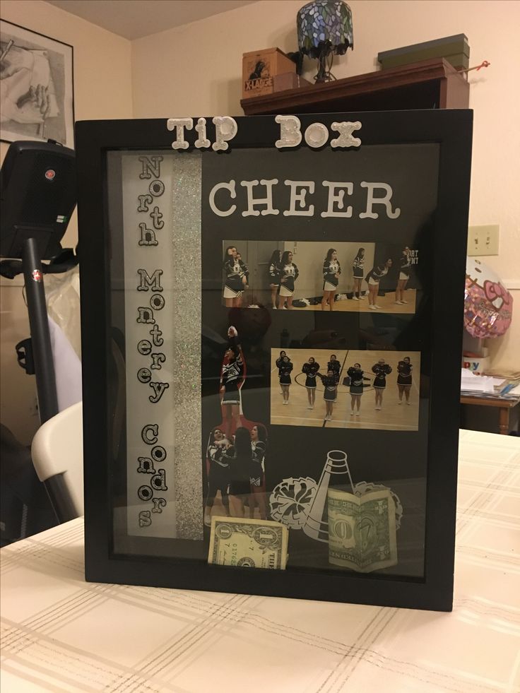 a sign that says tip box cheer with pictures of women in uniform and money on the table