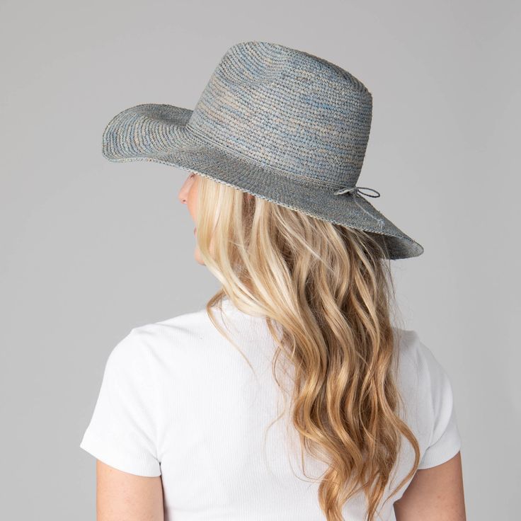 Be ready for any outdoor occasion in style with the Marina Women's Crochet Raffia Fedora. This exquisite fedora is crafted with 100% Crochet Raffia and features a 4" brim and adjustable size to fit perfectly. Choose between a brown, blue, or natural hue with the unique addition of twisted cording and bow in the center back. Elevate your ensemble and be the talk of the town in this one of a kind fedora. Features: Colors: Brown, Blue, & NaturalMaterials: 100% Crochet RaffiaBrim Size: 4" BrimSize: Blue Short Brim Straw Hat For Travel, Blue Straw Hat With Short Brim For Travel, Casual Blue Wide Brim Fedora, Casual Fitted Woven Hat, Casual Blue Fedora With Wide Brim, Blue Straw Hat For Spring, Casual Blue Straw Hat For Spring, Blue Casual Straw Hat For Spring, Blue Wide Brim Straw Hat For Spring