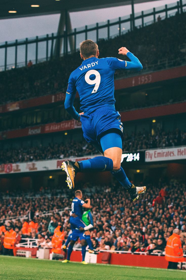 a soccer player is jumping in the air