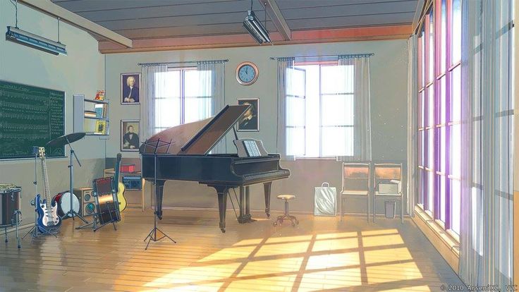 an empty room with a piano and other musical instruments