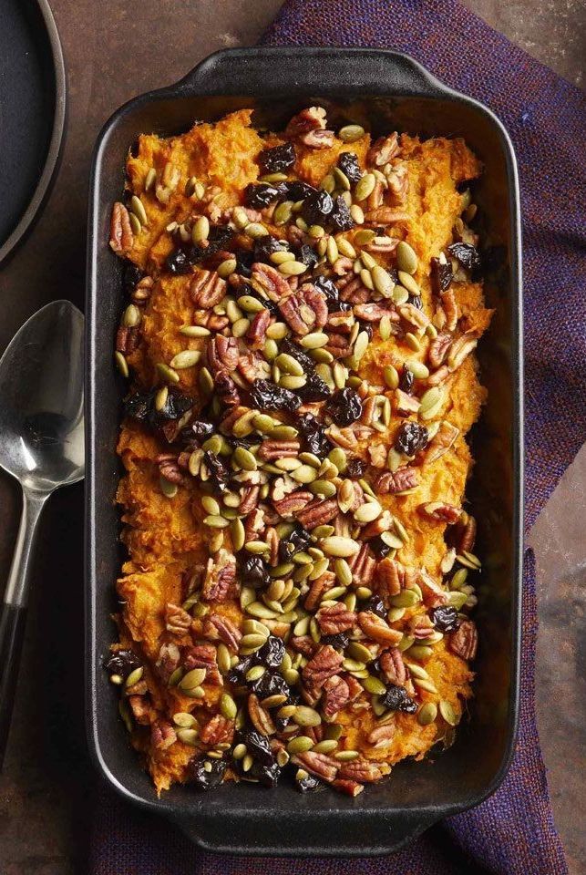 a casserole dish with pumpkin bread and nuts