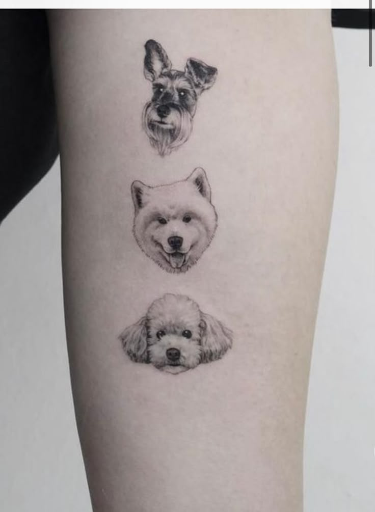 three dogs and a bear tattoo on the right thigh, one is black and white