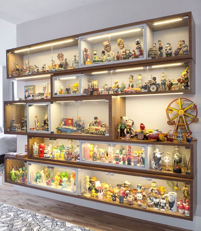 the shelves are filled with many different types of toys and figurines on them