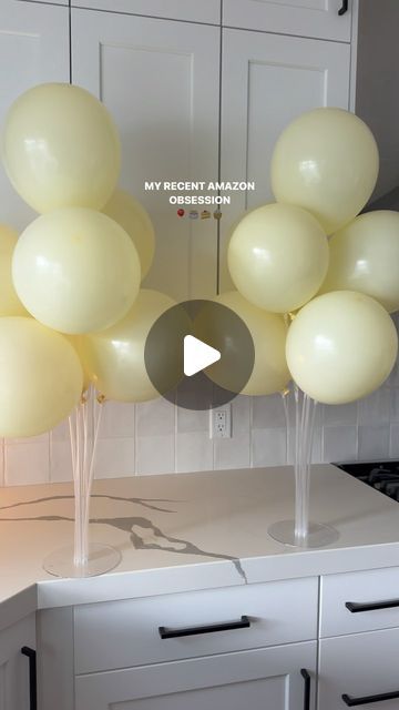 a bunch of balloons that are on top of a kitchen counter with the words my bright amazon