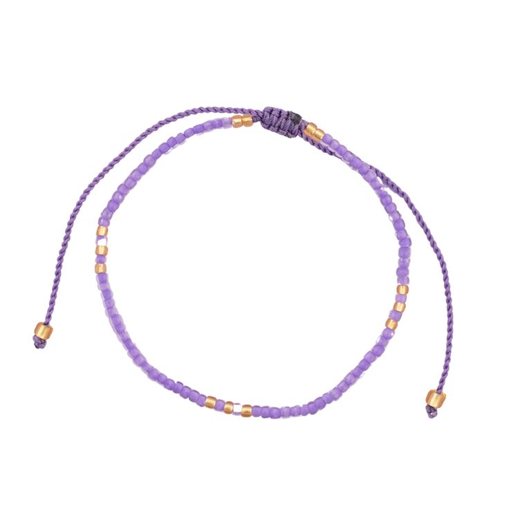 Get ready to dive into a world of purple paradise with our fabulous Purple Beaded String Bracelets, straight from the heart of Bali's artisanal scene! Handcrafted with passion and flair, each bracelet is a burst of color and creativity, designed to make you stand out in style. Choose from a dazzling array of purple hues and styles, from lilac purple to bright indigo—there's something for every taste and mood. Mix and match to create your own unique stack or share the love with your friends by gifting them as friendship bracelets! Our adjustable design ensures a comfortable fit for everyone, so you can dance, play, and live your best life with ease. Whether you're stacking them up or rocking them solo, these vibrant accessories are sure to turn heads and spark conversations wherever you go. Lavender Bracelets With Tiny Beads For Gift, Purple Tiny Beads Bracelets For Beach, Purple Beaded Bracelets With Tiny Beads For Beach, Purple Beaded Bracelets For Beach With Tiny Beads, Lavender Beaded Bracelet With Tiny Beads For Gifts, Purple Tiny Beads Beaded Bracelets As Gift, Adjustable Purple Bohemian Bracelets, Adjustable Lavender Bracelet With Tiny Beads, Adjustable Purple Bohemian Bracelet