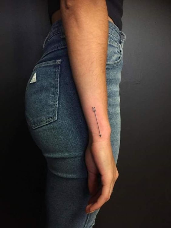 a person with a small tattoo on their arm