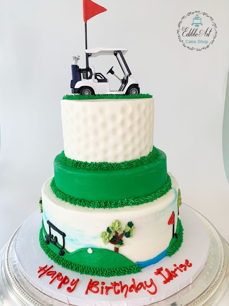 a golf themed birthday cake on a silver platter