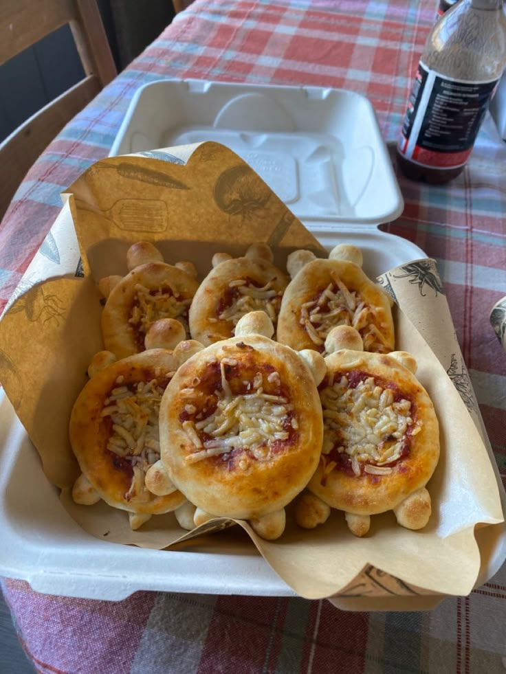 some food is in a paper container on a table