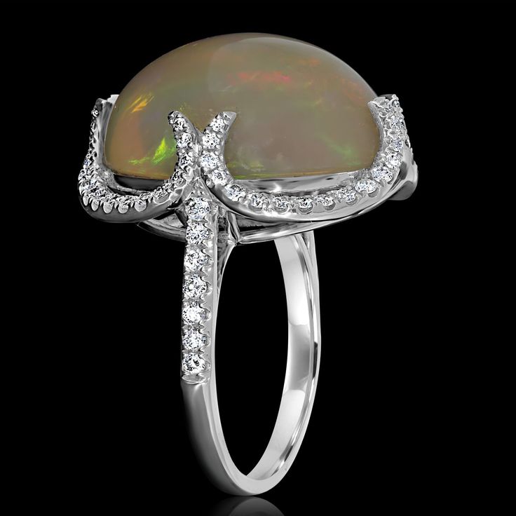 This 14K white gold ring is set with an oval-cut Opal, round Diamonds and is superbly designed. Product Information SKU ADG912417/1 Metal Type 14K Metal Color White Gold Ring Style Halo Metal Weight 4.6 Primary Stone Gemstone Name Opal No. Of Gemstones 1 Gemstone Shape Oval Gemstone Weight 12.28 Gemstone Treatment - Secondary Stone Gemstone Name Diamond Gemstone Shape Round Gemstone Color - Gemstone Grade - Gemstone Clarity - Gemstone Weight 0.67 14k White Gold Ring, Ring Style, Opal Ring, White Gold Ring, Gemstone Name, Opal Rings, Diamond Gemstone, White Gold Rings, Metal Color