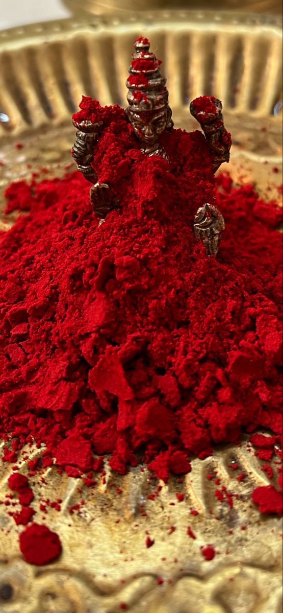 red powdered food in a metal bowl