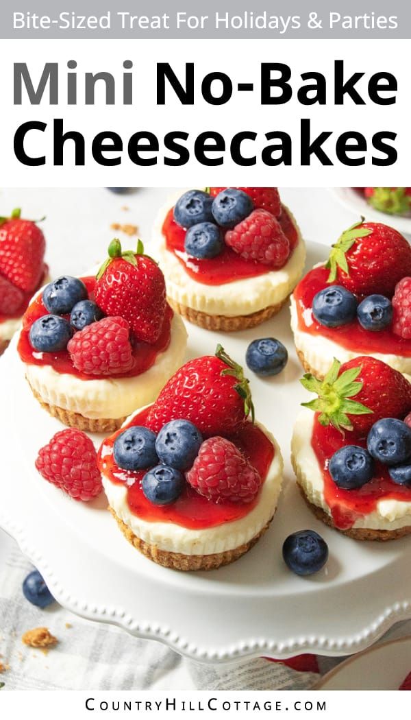 mini no - bake cheesecakes with berries and blueberries are on a white plate