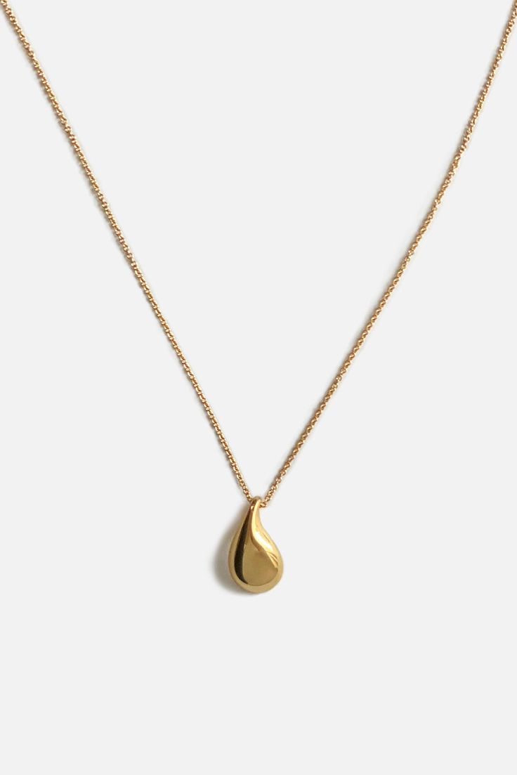 Designer Notes + Modern and elegant hand carved water drop pendant necklace that works as your everyday statement piece. Details + Materials: Pendant: Gold: 14K yellow gold plated sterling silver, a thick layer of electroplating for durability. Silver: high polished sterling silver. Chain: Solid gold filled tarnish-resistant chain. / Sterling silver chain. Measurements: 1.8 cm length 1 cm width Chain length: 18 inches (46 cm) Weight: 3.3 grams Handcrafted by artisans in New York City. Water Drop Pendant Necklace, Simple Gold Pendant, Couple Ring Finger Tattoos, Ring Tattoo Designs, Water Drop Necklace, Ring Finger Nails, Minimal Pendant, Ring Finger Tattoos, Drop Pendant Necklace