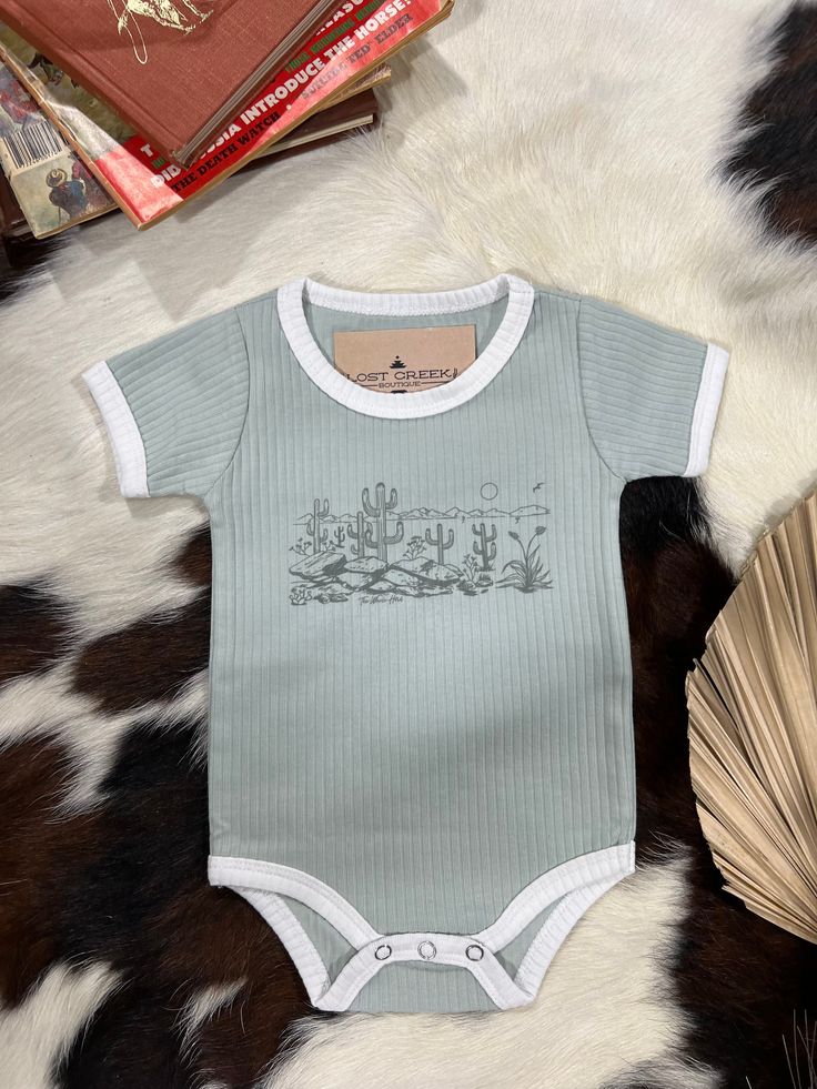 The CUTEST and SOFTEST bodysuits we have EVER seen! These Ribbed Bodysuits are INCREDIBLE QUALITY and so perfect for boys and girls! Pair these with our new headwraps for the little gals to complete the outfit! Unisex Fit Soft True To Size Casual Fitted Short Sleeve Bodysuit For Playtime, Green Fitted Casual Onesie, Fitted Casual Bodysuit For Playwear, Green Fitted Short Sleeve Bodysuit Casual, Fitted Casual Onesie For Playtime, Fitted Playful Short Sleeve Bodysuit For Playwear, Playful Fitted Short Sleeve Bodysuit For Playwear, Casual Fitted Onesie For Playtime, Fitted Cotton Bodysuit For Playwear