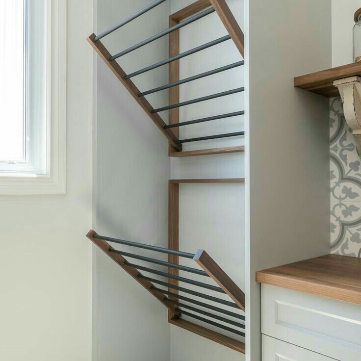 a stair case next to a window in a kitchen