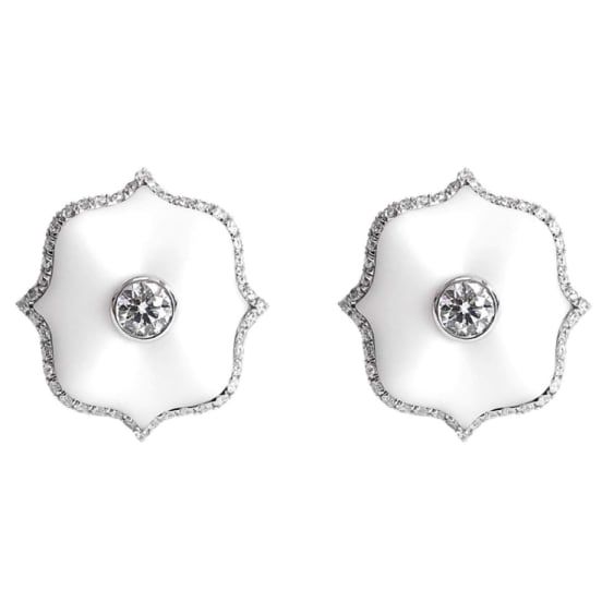 A pair of platinum Mini Lotus ear clips each centered upon a round brilliant-cut colorless diamond set in matte white ceramic with a colorless diamond micropavé surround. Luxury White Earrings With Single Cut Diamonds, White Luxury Earrings With Single Cut Diamonds, Exquisite White Diamond Earrings For Evening, Exquisite White Platinum Earrings, Luxury Diamond Earrings With Halo Design, Luxury Diamond White Earrings With Accents, Luxury White Diamond Platinum Earrings, Luxury White Platinum Diamond Earrings, Luxury Platinum Earrings With Single Cut Diamonds