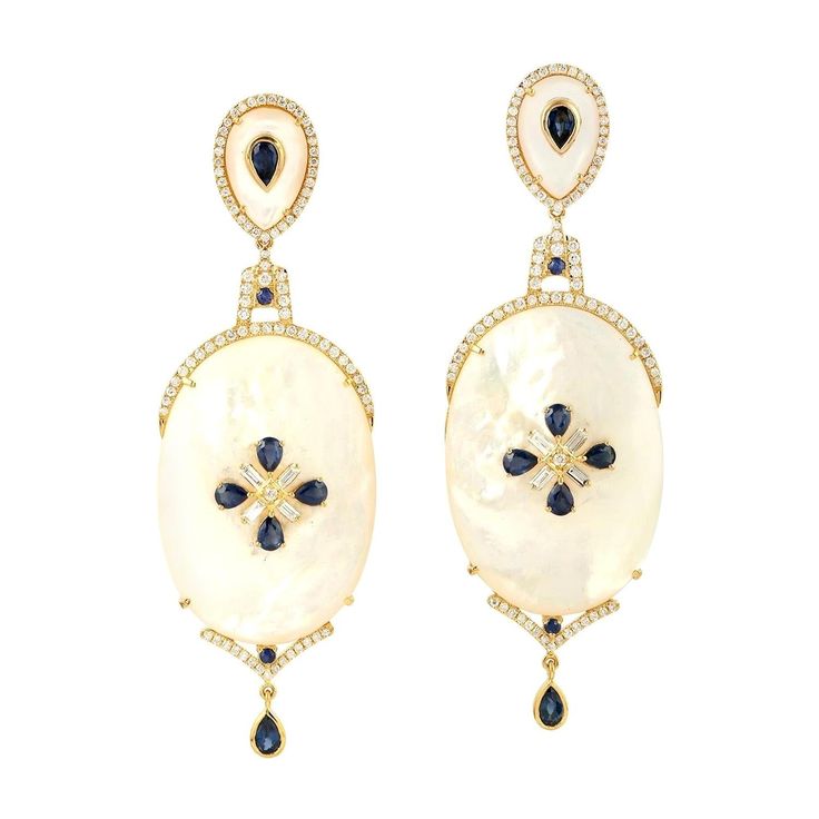 Cast in 18-karat gold, these beautiful earrings are set with 2.72 carats sapphire, 68.05 carats mother of pearl and 1.45 carats of glimmering diamonds. FOLLOW MEGHNA JEWELS storefront to view the latest collection & exclusive pieces. Meghna Jewels is proudly rated as a Top Seller on 1stDibs with 5 star customer reviews. All items manufactured by us are handmade and can be customized or redesigned. Composition Size-75X25 Total Weight-26.78 Gold Weight(Gms)-12.336 Diamond Wt(Cts)-1.45 MOP Wt(Cts)-68.05 Sapphire Wt(Cts)-2.72 Pearl Diamond, Mother Pearl, Beautiful Earrings, Blue Sapphire, Mother Of Pearl, Jewelry Earrings Dangle, Gold Earrings, Dangle Earrings, Sapphire