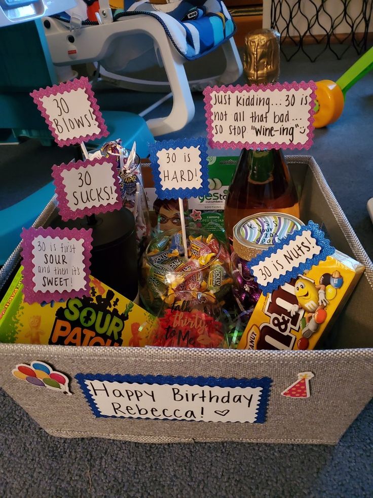 a birthday gift box filled with candy and treats