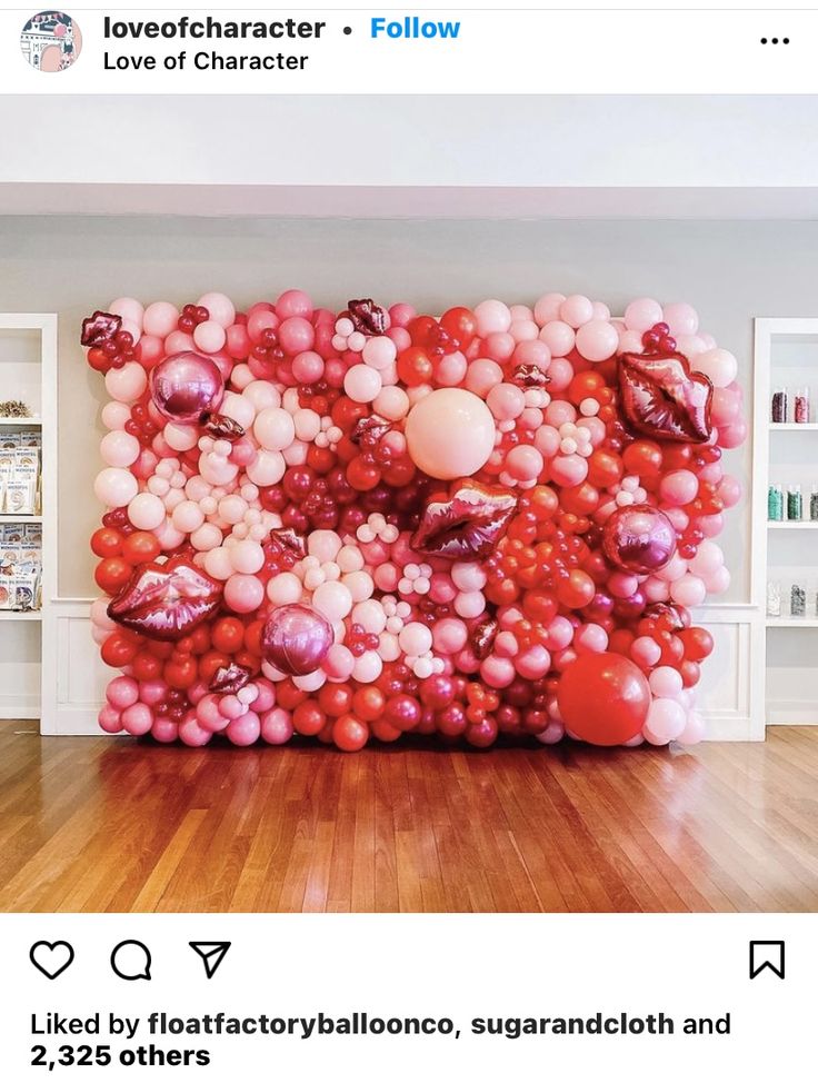 a large balloon wall in the middle of a room