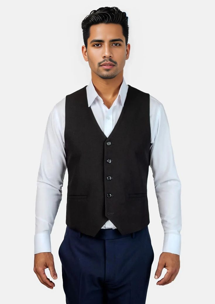 This Midnight Black Vest is designed with stretch cotton for comfort in classic black that is timeless in style. Level up your two piece black stretch suit with this custom made vest for a three piece look that is sure to impress. Classic Notch Lapel Vest For Office, Tailored Classic Vest For Office Wear, Elegant Black Sleeveless Suit, Classic Black Vest For Business, Elegant Black Suit With Vest, Tailored Cotton Business Vest, Black Cotton Suits For Workwear, Formal Fitted Black Vest, Tailored Cotton Vest For Business