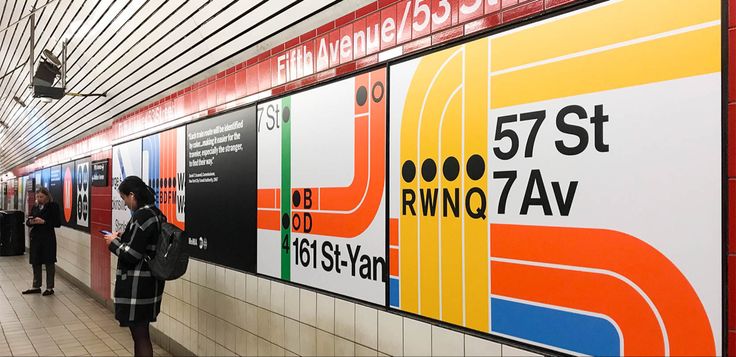 people are standing in line at the subway station