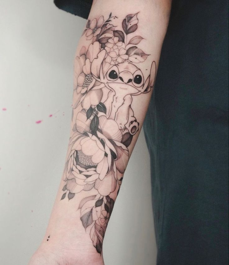 a person with a flower tattoo on their arm