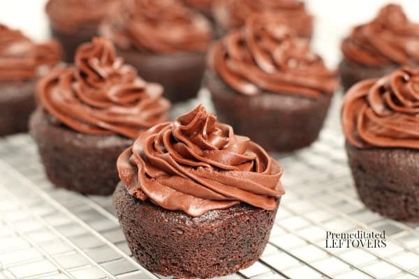 chocolate cupcakes with frosting on a cooling rack