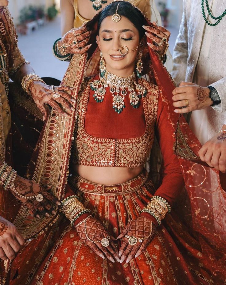 the bride is getting her makeup done before she walks down the aisle for the ceremony