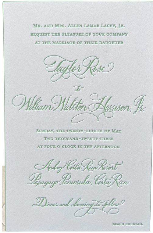 a wedding card with green lettering on it