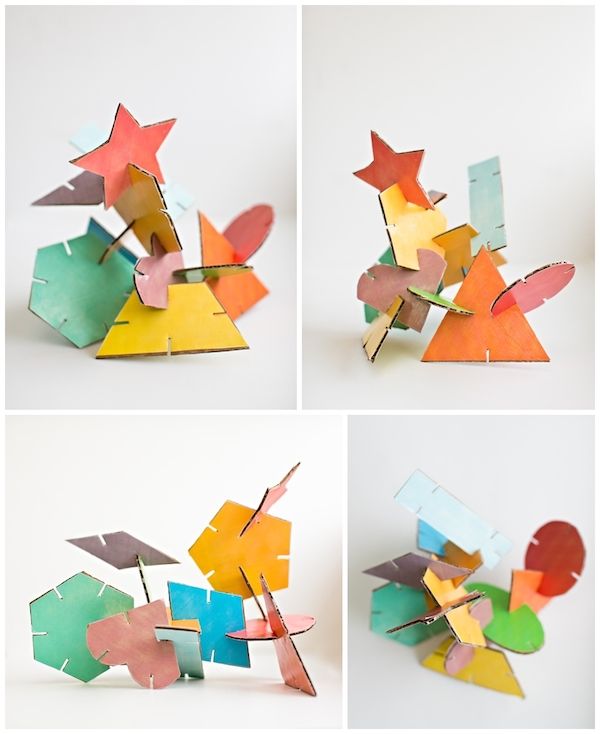 four different angles of the same piece of art made out of colored paper and cardboard