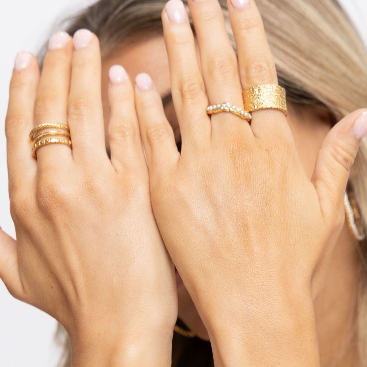 Elevate your look with the Catalina Pearl Ring! This playful and whimsical ring boasts a charming hammered design and a stunning pearl at its center. Perfect for any occasion, it's sure to capture attention and evoke joy. Brazilian Gold Filled Hypoallergenic Water & Tarnish Resistant Elegant Hammered Midi Rings For Wedding, Delicate Hammered Ring Jewelry, Delicate Hammered Jewelry Ring, Hammered Stackable Open Rings For Weddings, Adjustable Hammered Stackable Wedding Rings, Wedding Hammered Stackable Rings, Wedding Stackable Hammered Open Rings, Tarnish Resistant Toe Rings, Elegant Open Band Hammered Ring