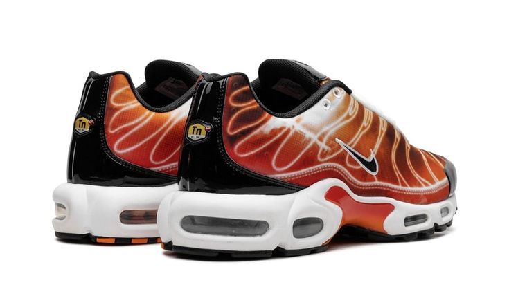 The Nike Air Max Plus "Light Photography - Sport Red" is a fiery colorway of the retro performance running shoe.  The shoe has a red and orange graphic upper inspired by light streaks in slow shutter speed photography.  White accenting contrasts the black Swoosh on either side while a classic yellow “TN” badge is found on the heel.  Underfoot, the shoe is mounted on a white foam midsole with visible Air units in the forefoot and heel.  Release date: August 29, 2023 Slow Shutter Speed Photography, Light Streaks, Speed Photography, Photography Sport, Shutter Speed Photography, Orange Graphic, Slow Shutter, Red Nike, Nike Air Max Plus