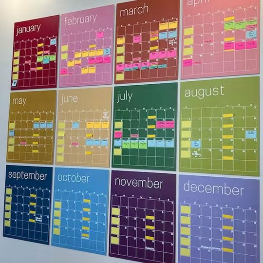 a colorful calendar is hanging on the wall