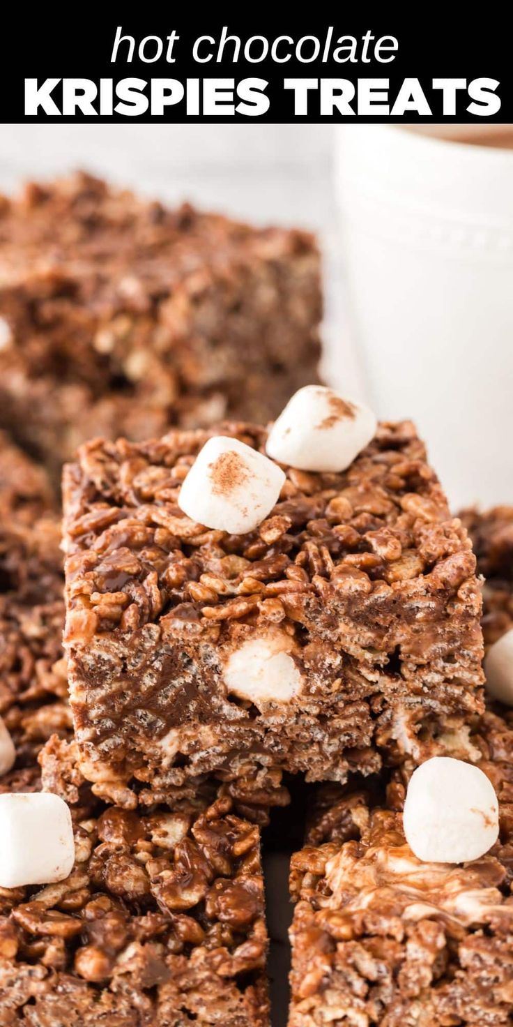 chocolate krispies treats stacked on top of each other with marshmallows in the middle