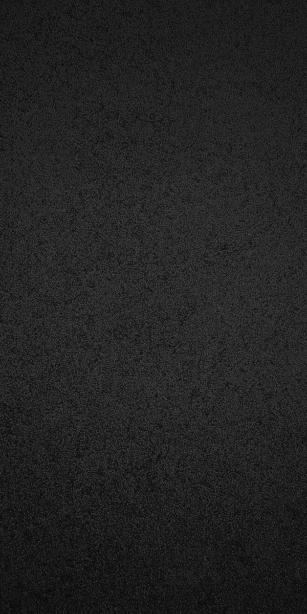 a black and white photo of the surface of a dark room with no one in it