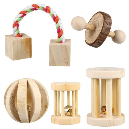 various wooden toys including bells and rings on white background with clippings for stringing