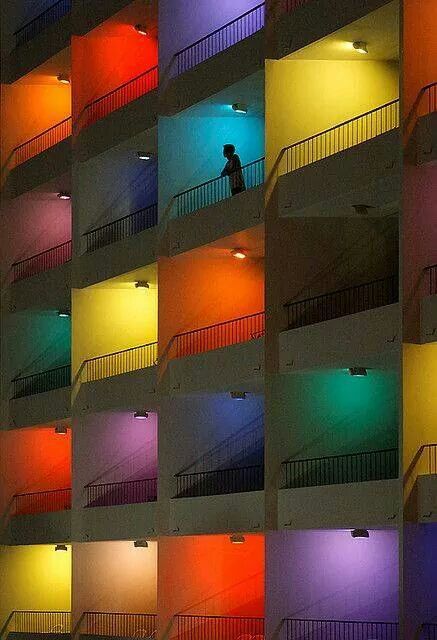 a building with multicolored walls and balconies