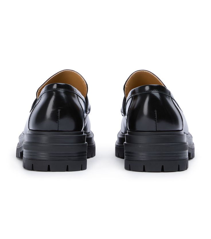 Stand-out from the crowd with our Wiz loafer. Showcasing a shiny black leather exterior, this design features an exaggerated chunky sole with a sleek rounded toe-shape, a high-cut vamp and is finished with a leather upper, lining and cushioned foot-bed. -Material: Leather Upper & Lining -Sole: Man-Made -Fit: We recommend choosing a half size down -Toe-shape: Rounded -Features: Chunky sole -Heel: 4.5cm Business Platform Loafers With Lug Sole In Patent Leather, Black Platform Loafers For Office, Modern Black Platform Loafers With Lug Sole, Black Formal Platform Loafers With Lug Sole, Modern Black Platform Loafers With Chunky Sole, Black Platform Loafers With Lug Sole For Formal Occasions, Black Platform Loafers With Lug Sole For Formal Wear, Modern Black Platform Loafers With Chunky Platform, Black Chunky Platform Loafers For Work