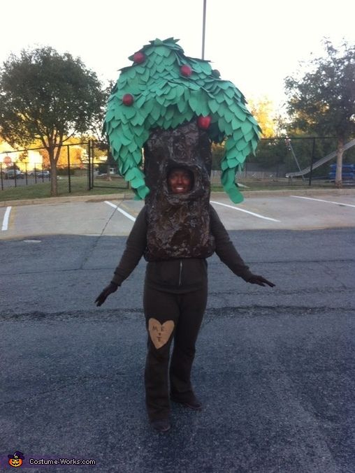 a person in a costume made to look like a tree